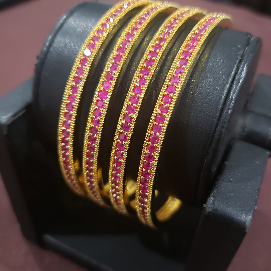 Pink stone bangles.
