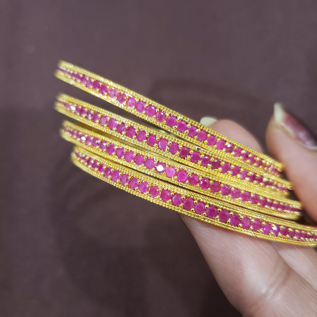 Pink stone bangles.