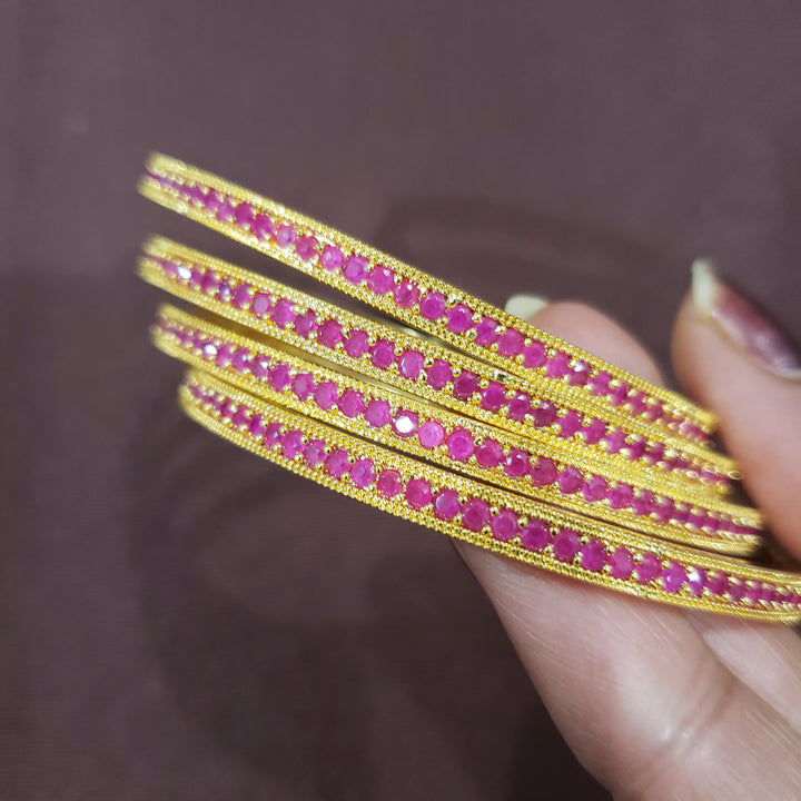 Pink stone bangles.