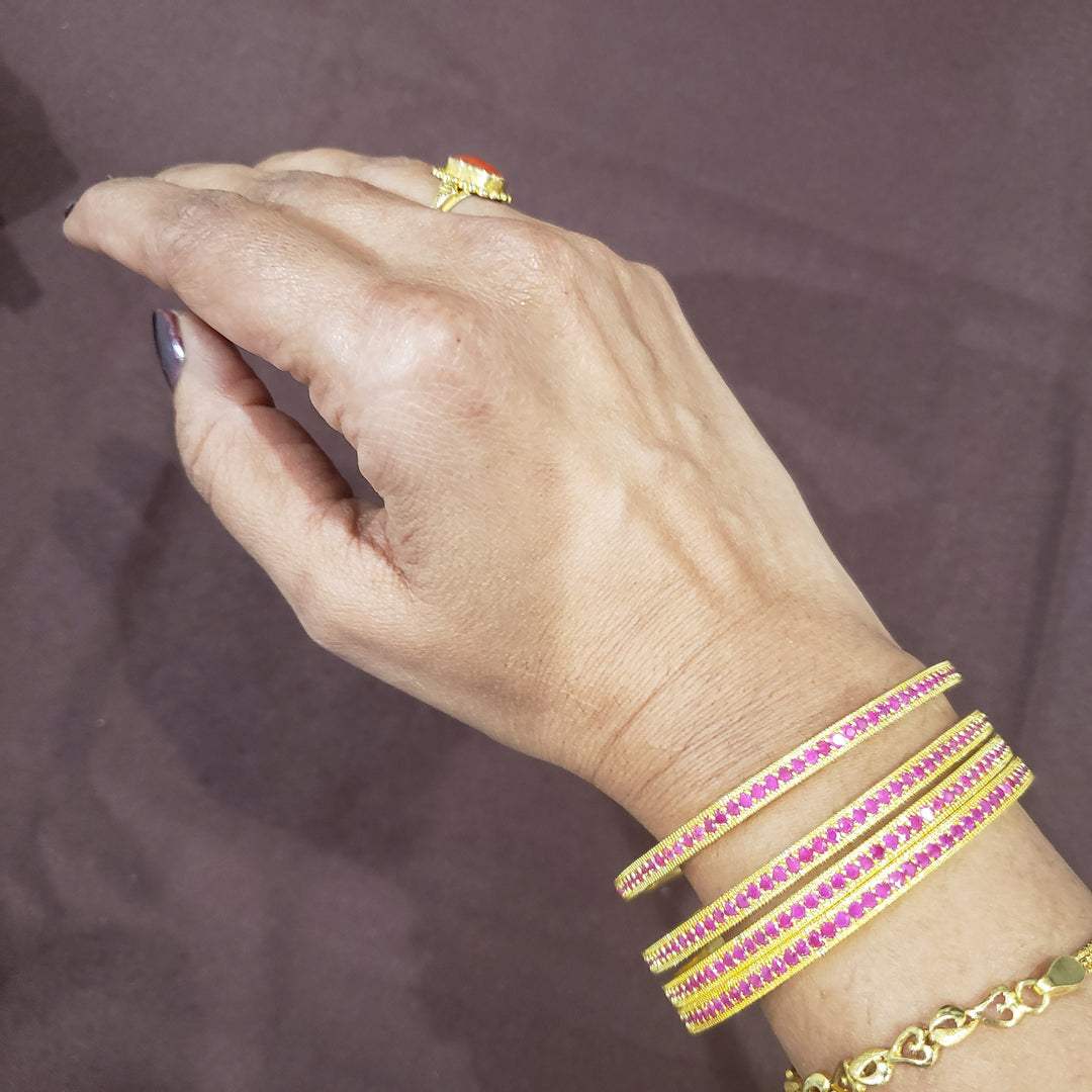 Pink stone bangles.