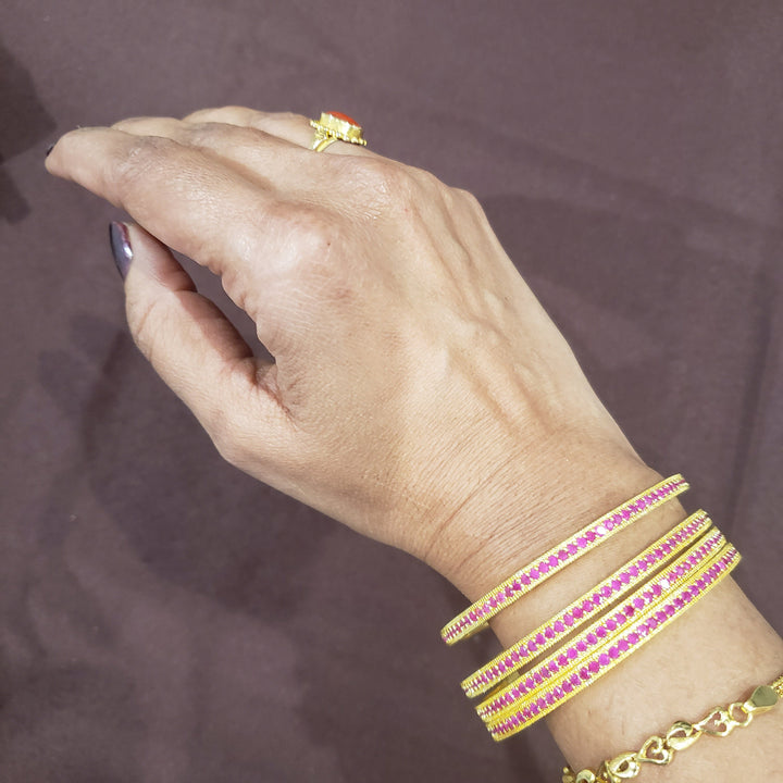 Pink stone bangles.