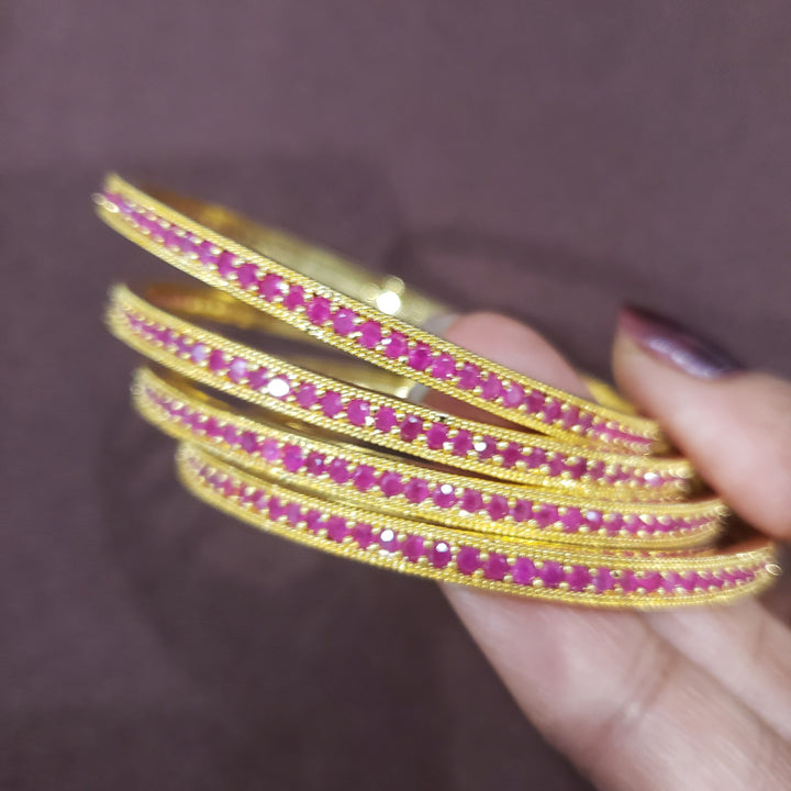 Pink stone bangles.