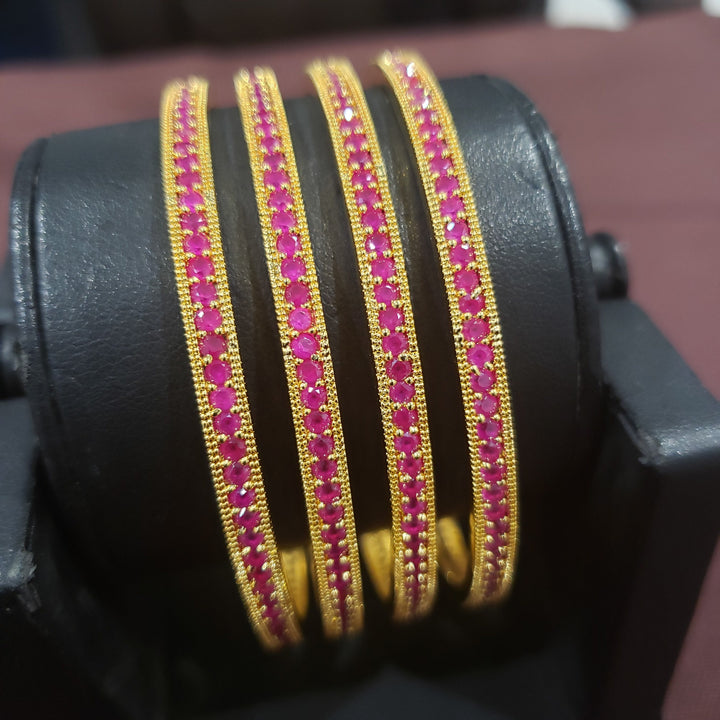 Pink stone bangles.