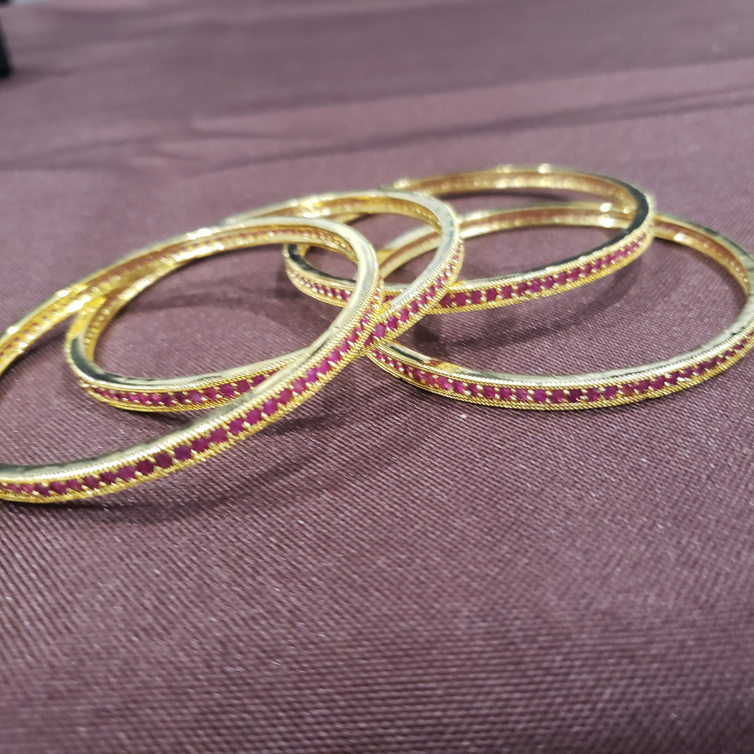 Pink stone bangles.