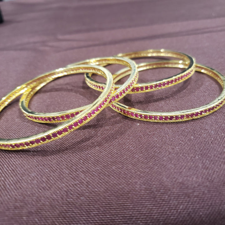 Pink stone bangles.