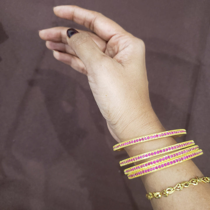 Pink stone bangles.