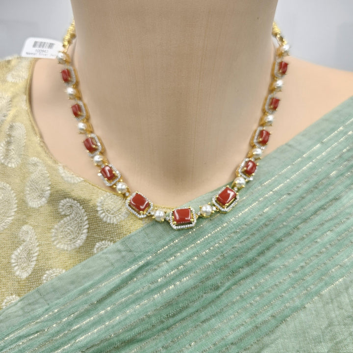 coral diamond rep necklace