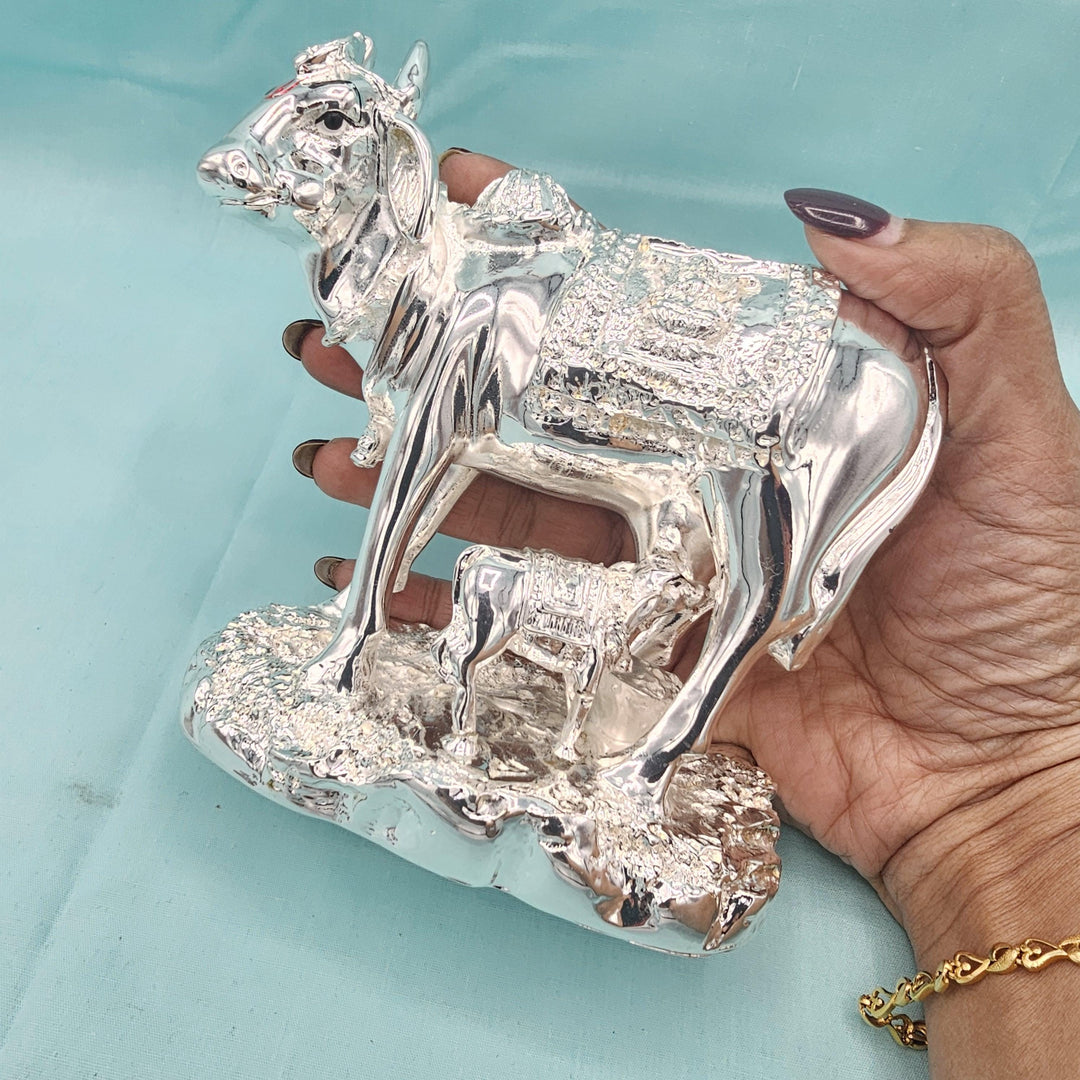Silver cow and calf idol