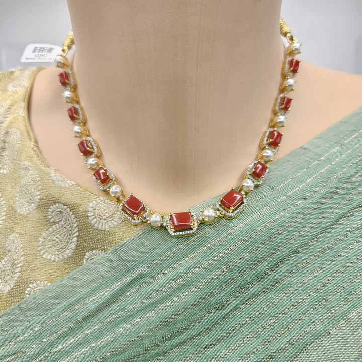 coral diamond rep necklace