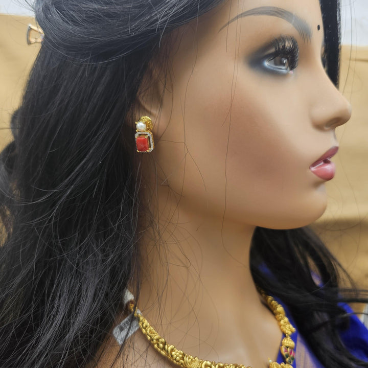 coral diamond rep necklace